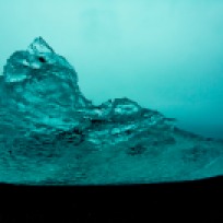 Iceberg on black volcanic beach Canon